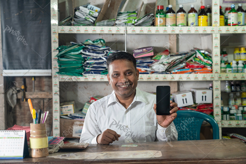 Agriculture dealer showing mobile for online order