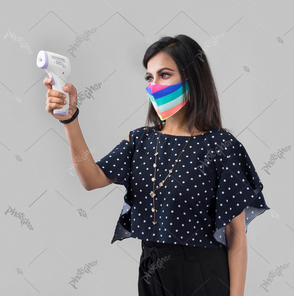 Alertness young woman using digital thermometer