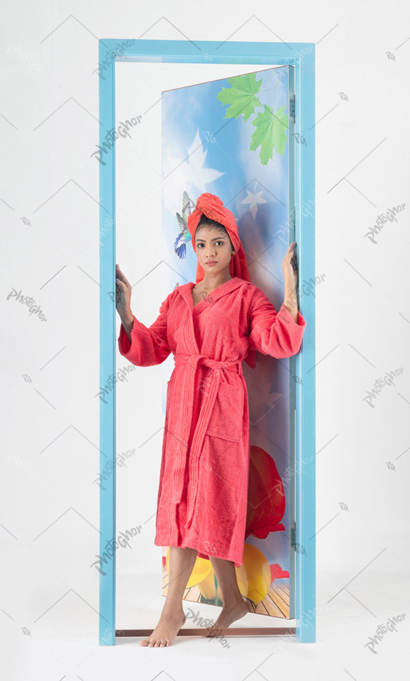 Attractive young girl in pink shower towel