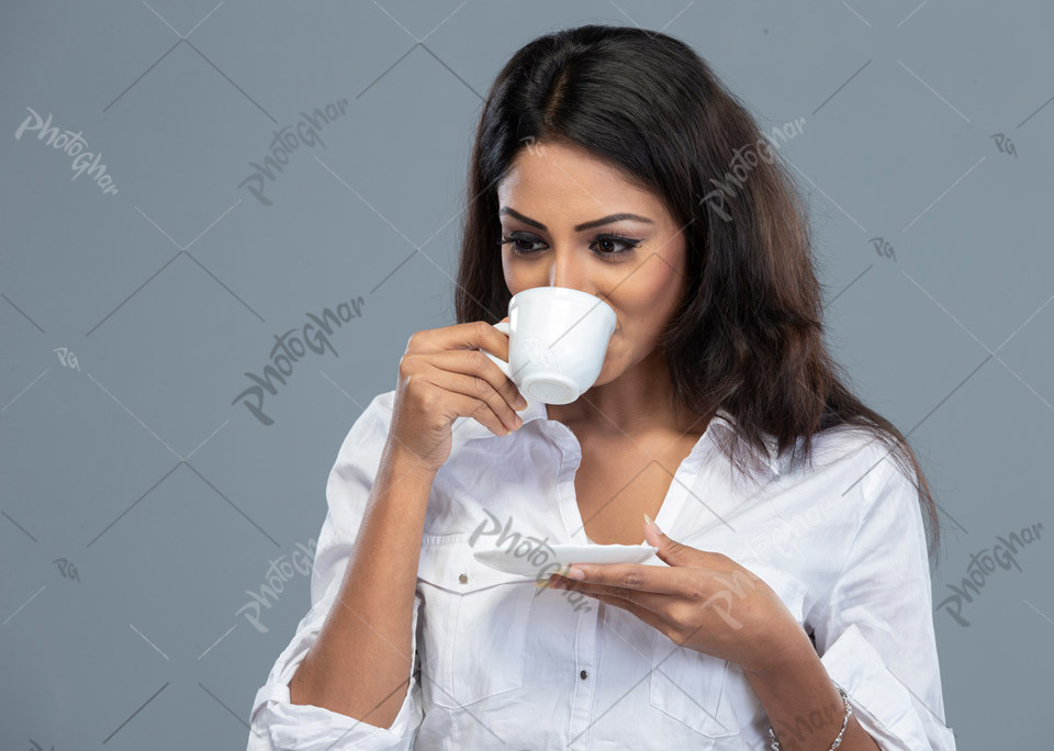 Bangladeshi beautiful lady drinking tea