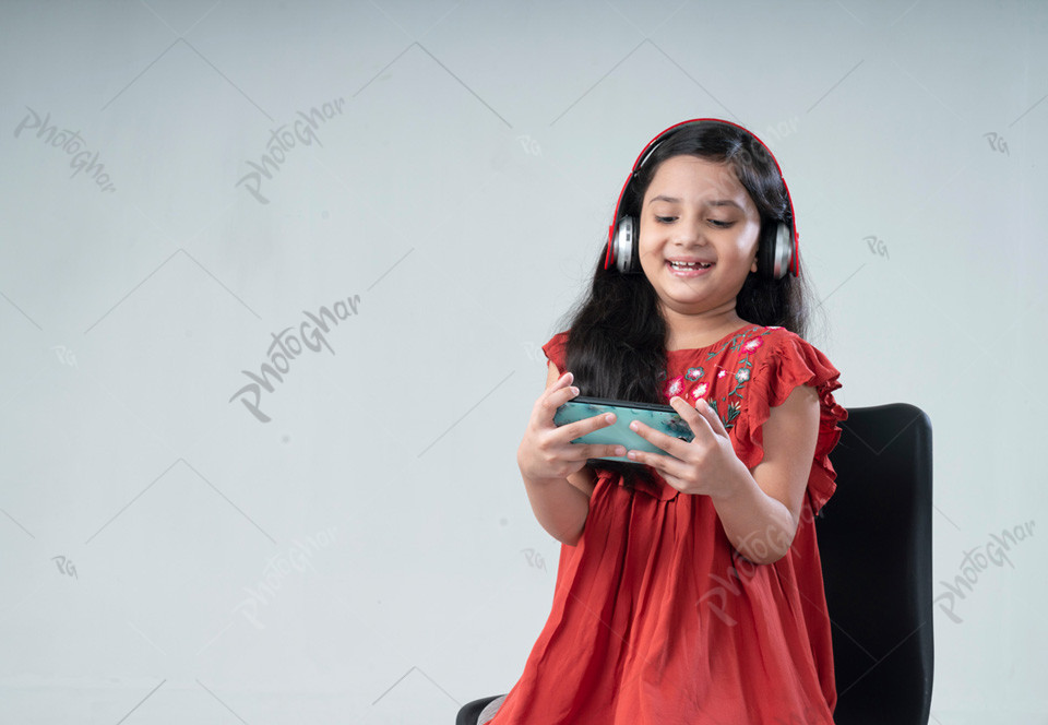 Bangladeshi child holding mobile phone