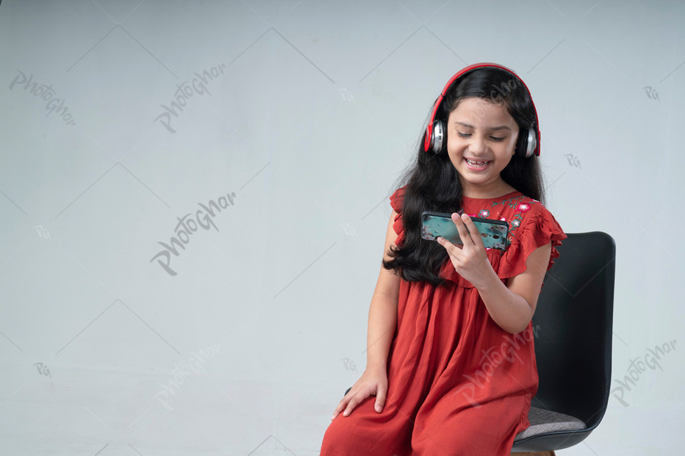 Bangladeshi child wearing headphones