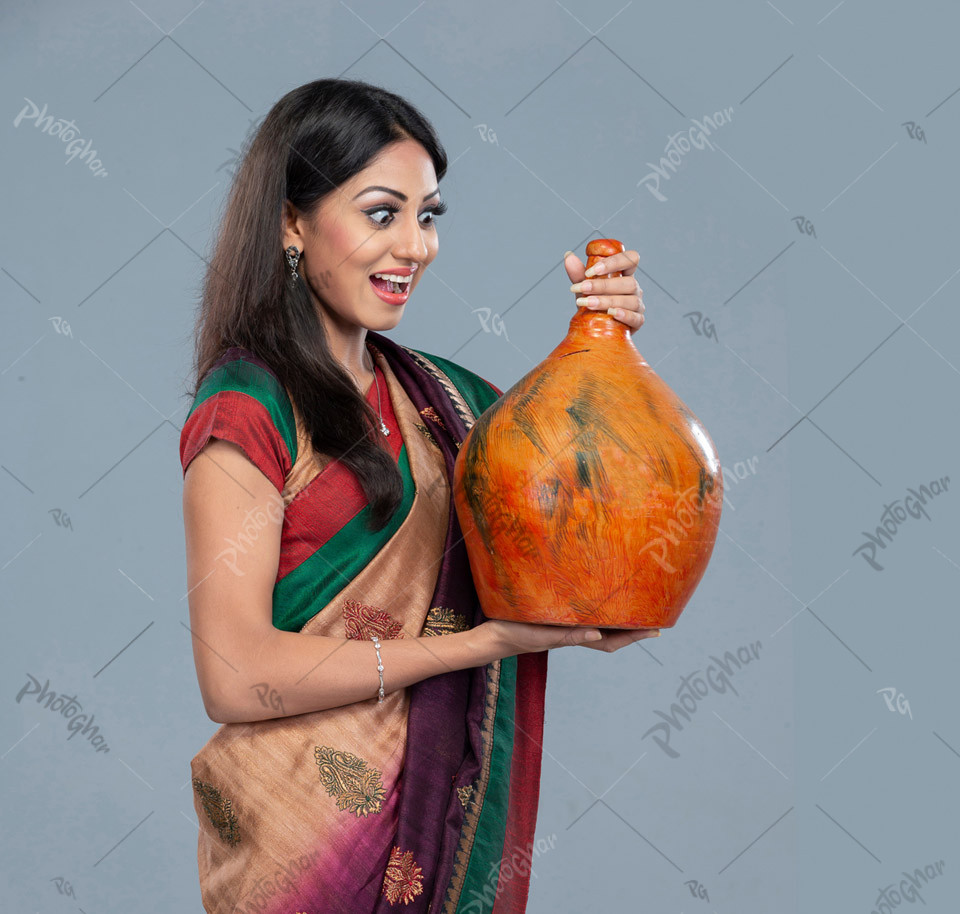 Bangladeshi female holding piggybank