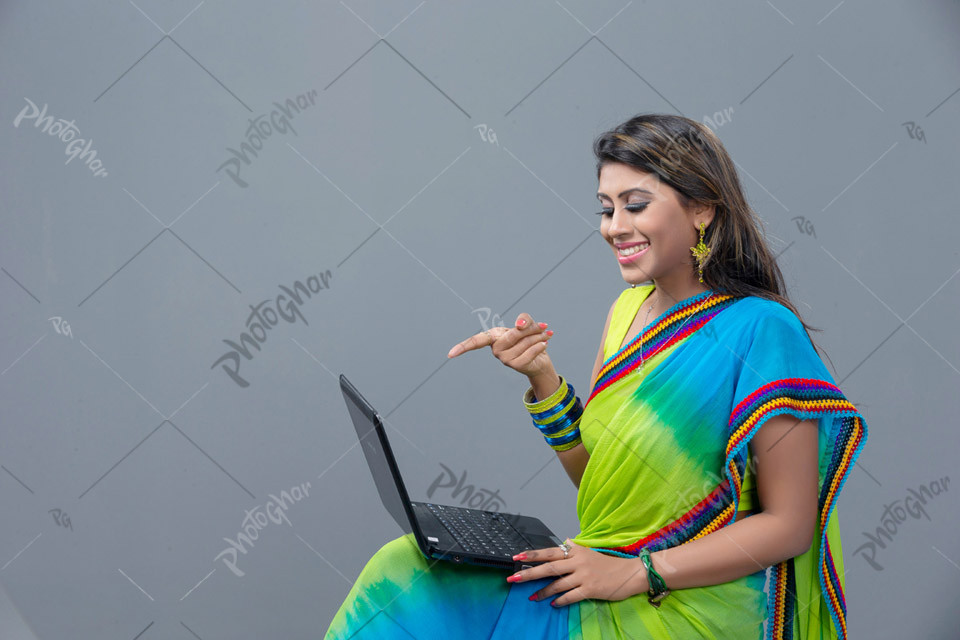 Bangladeshi freelancer pointing to the laptop screen