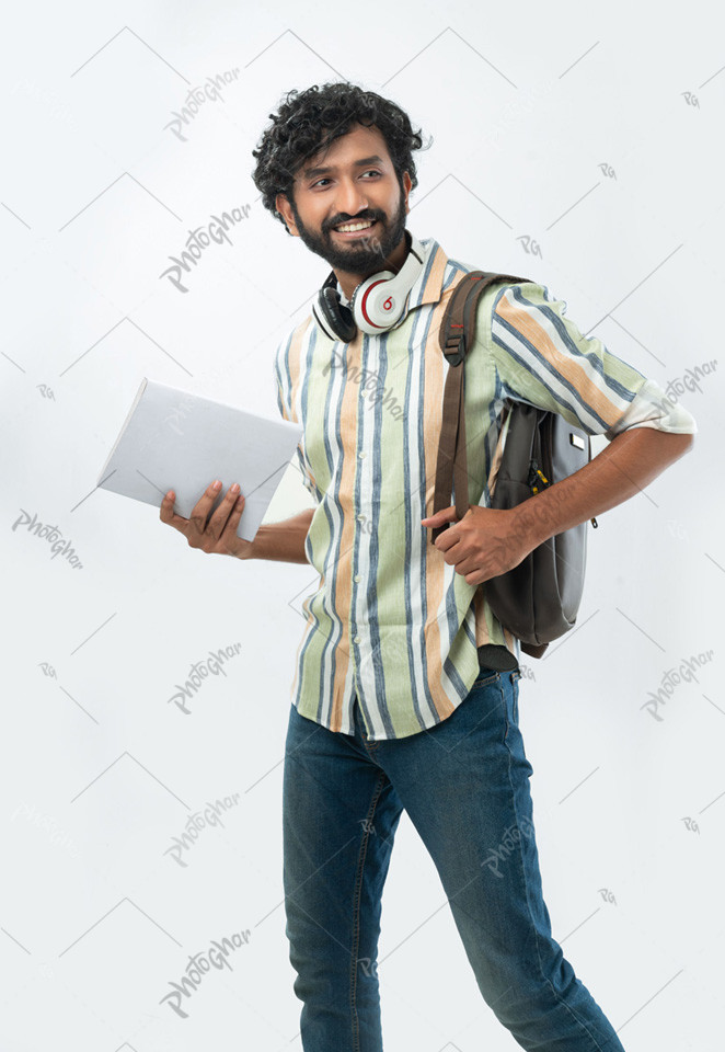 Bangladeshi male student with book, headphone