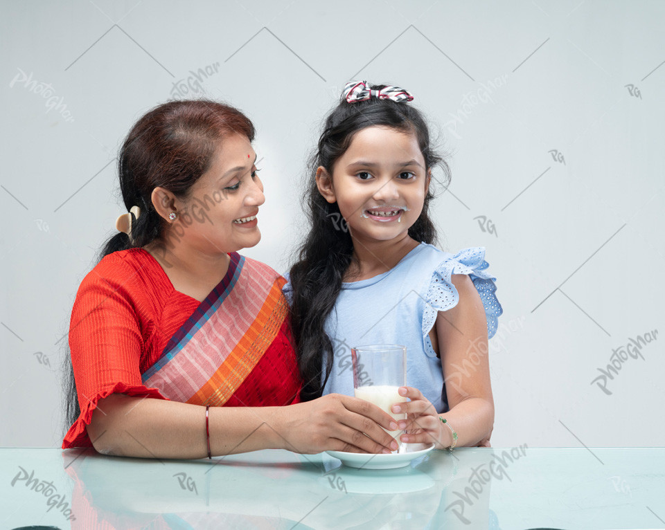 Bangladeshi mother giving milk