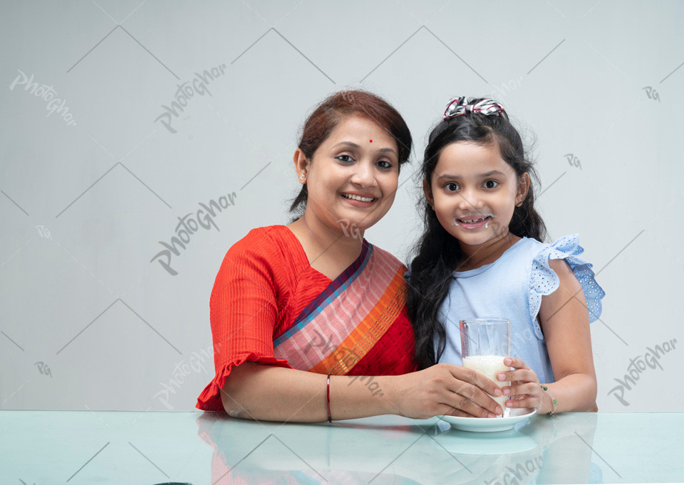 Bangladeshi mother giving milk