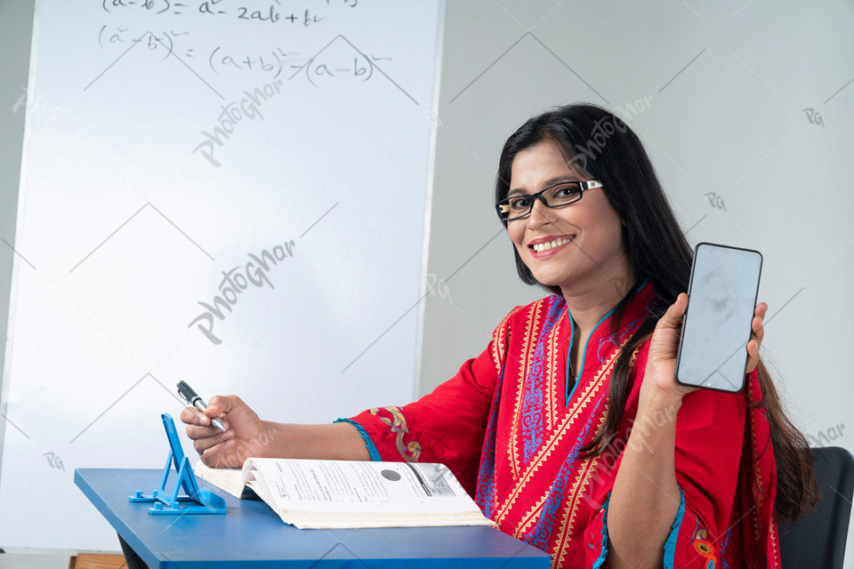 Bangladeshi teacher showing smartphone