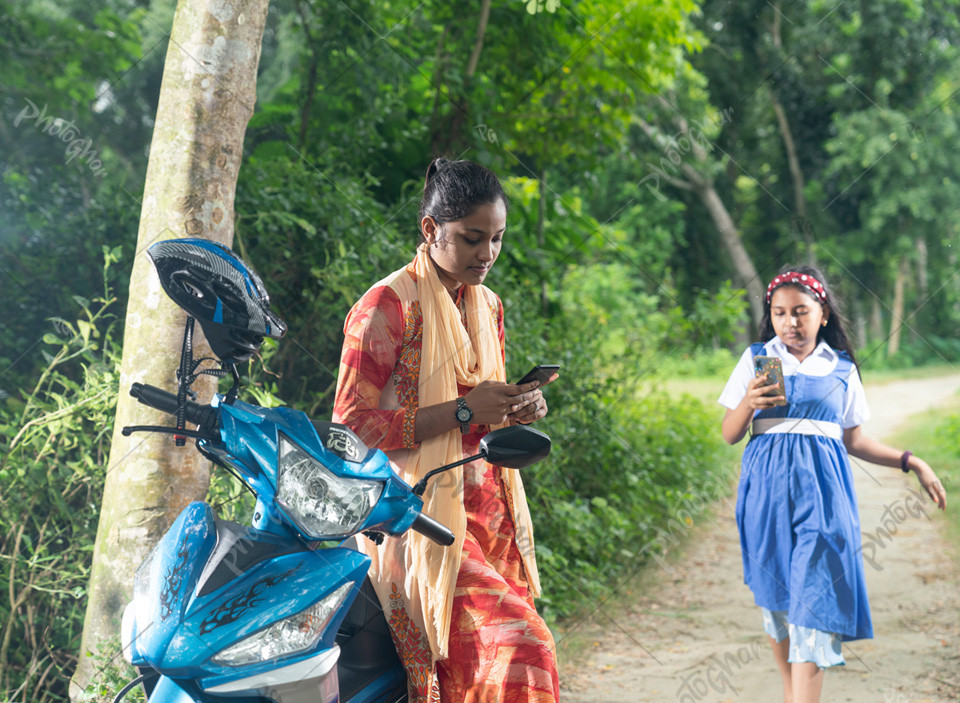 Bangladeshi village people using mobile phone