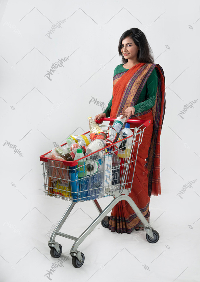 Bangladeshi woman pushing shopping trolley