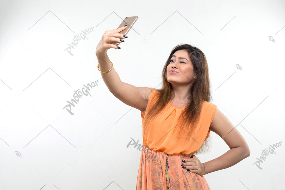 Bangladeshi woman taking selfie