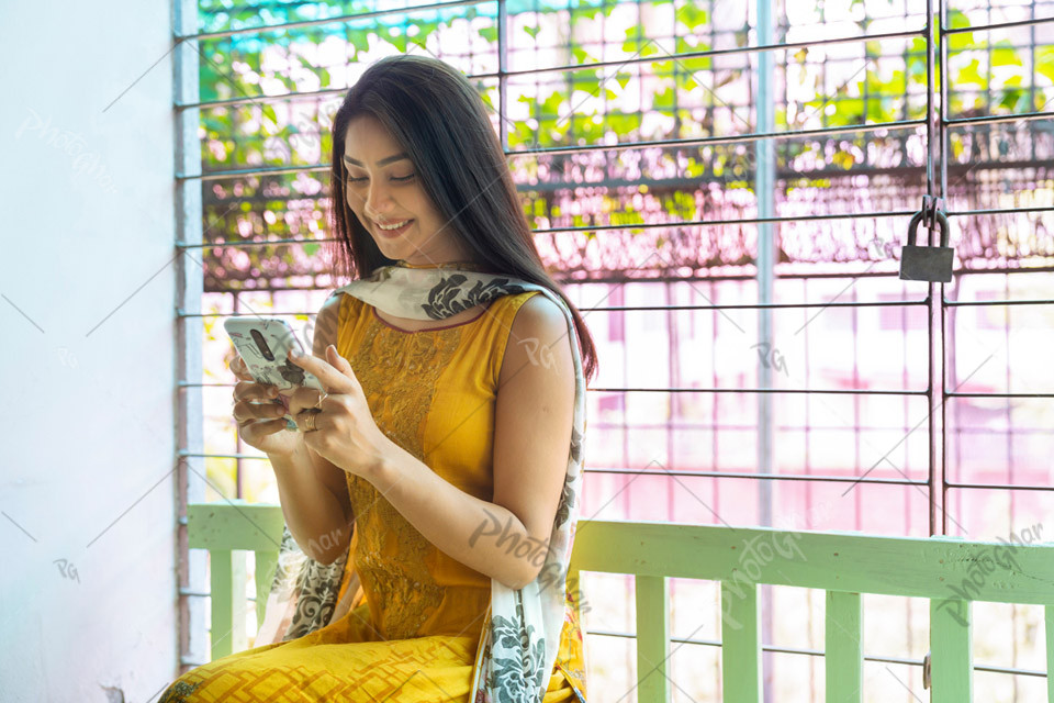 Bangladeshi young woman using smartphone