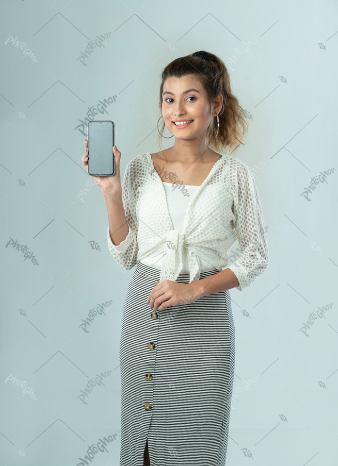 Beautiful girl showing mobile screen