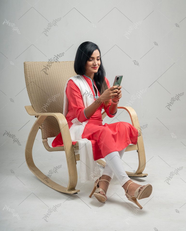 Beautiful girl using Comfortable rocking chair