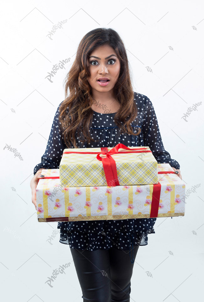 Beautiful shocked housewife holding gift boxs