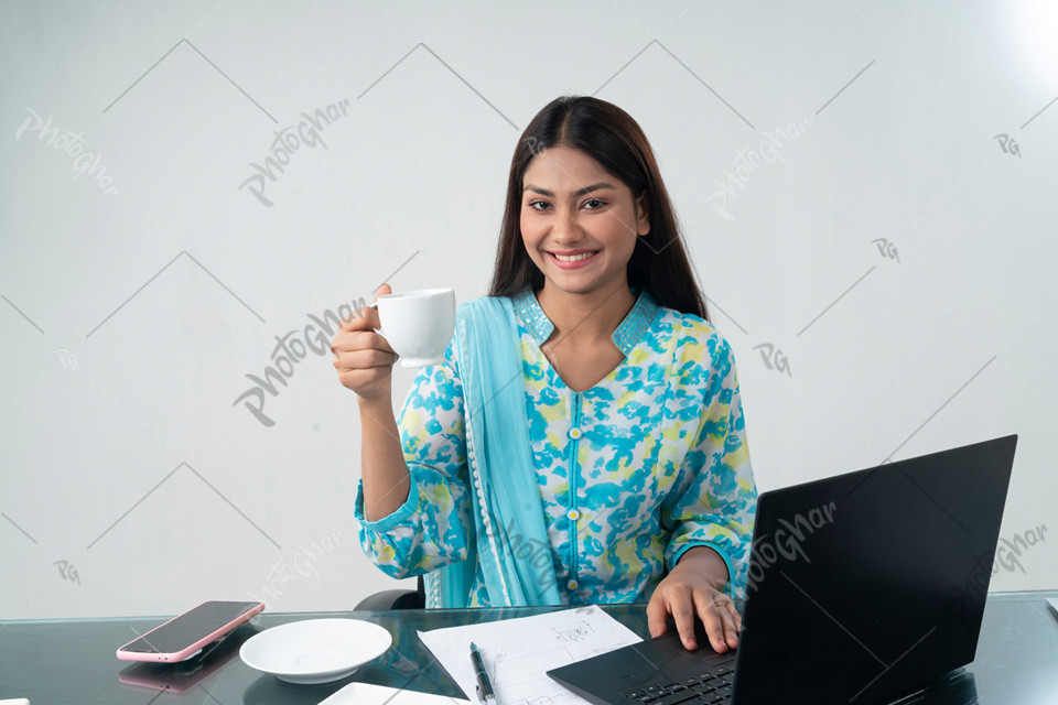 Beautiful smiling woman talking cup of tea