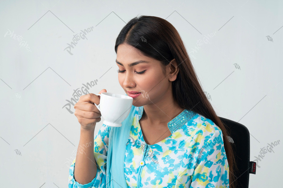 Beautiful woman enjoying morning coffee