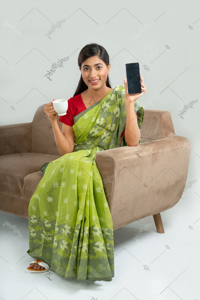 Beautiful woman showing smartphone screen