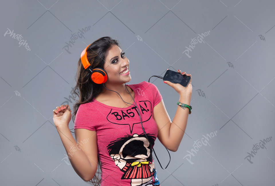 Beautiful young woman listening to music