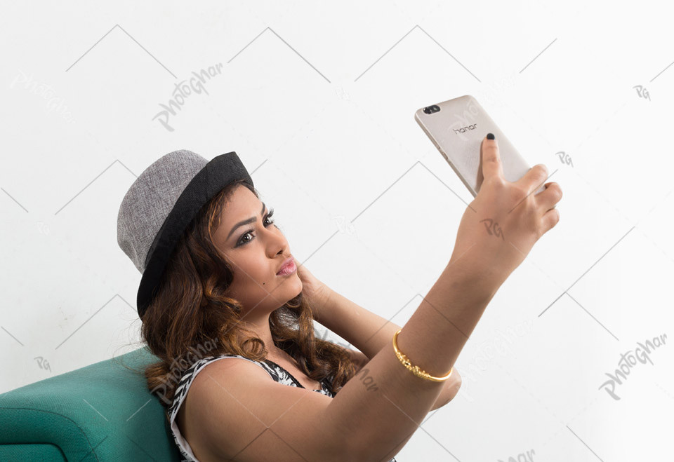 Beautiful young woman tourist taking selfie