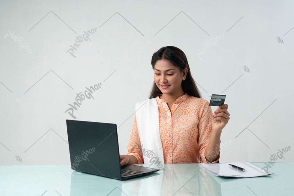 Business woman holding bank card