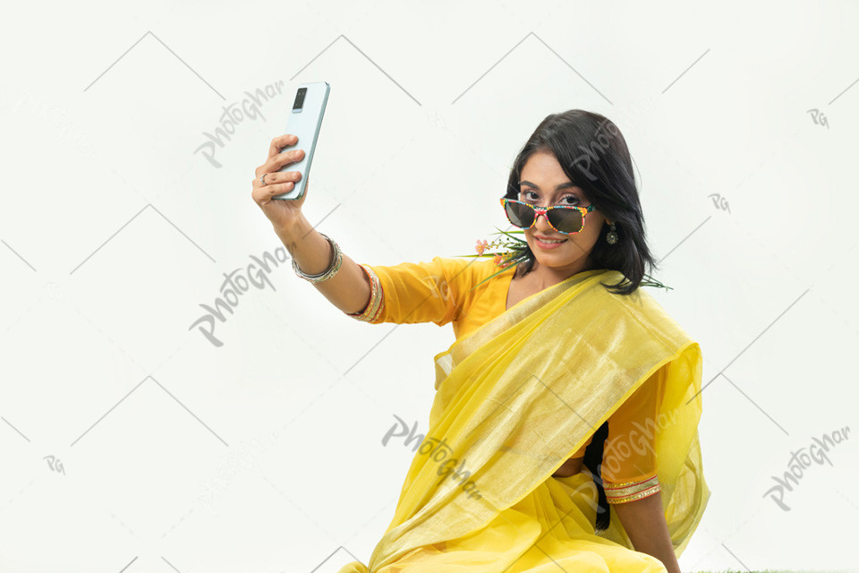 Celebrating woman taking selfie