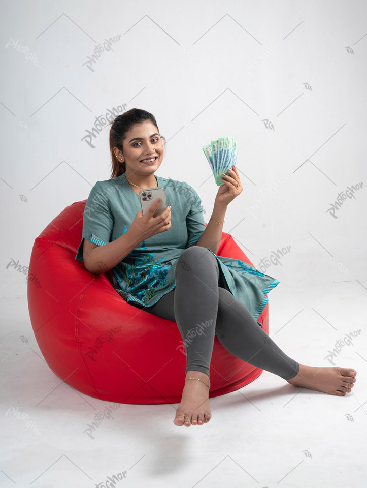 Cheerful Young Woman Cashes Out