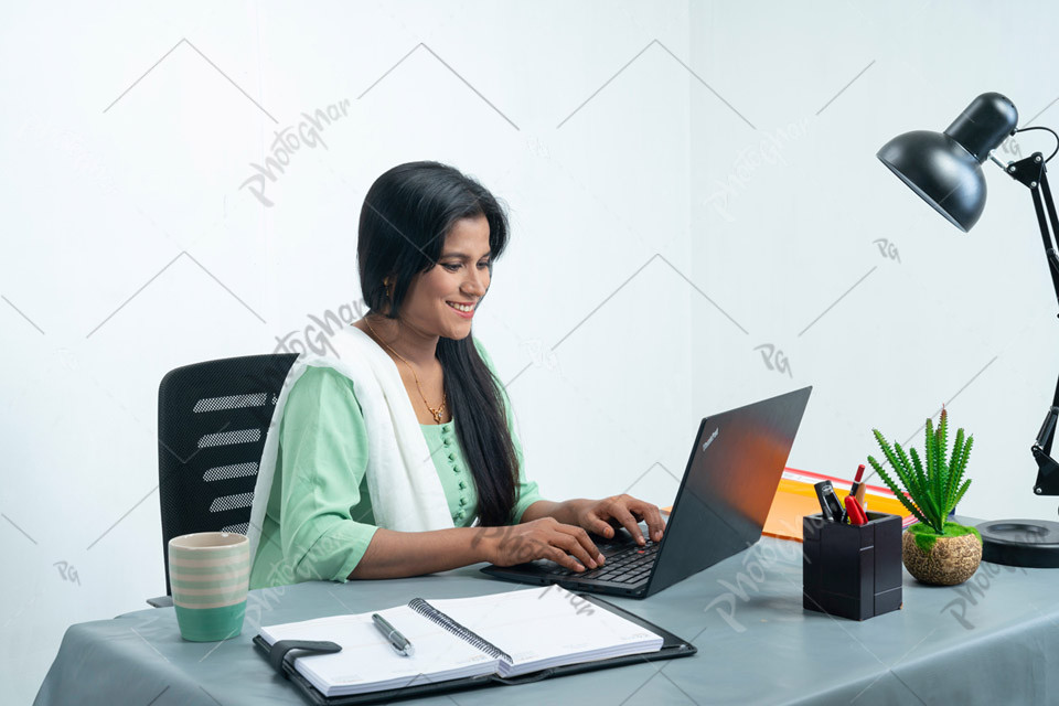 Cheerful business lady working in office