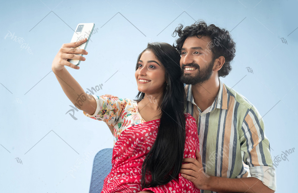 Cheerful couple taking selfie