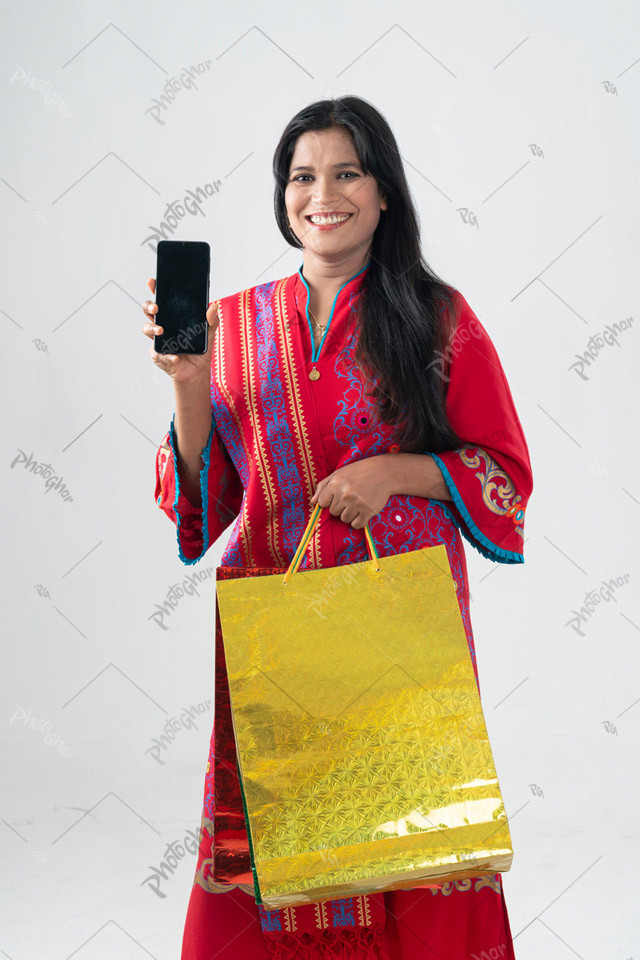 Cheerful housewife showing smartphone apps