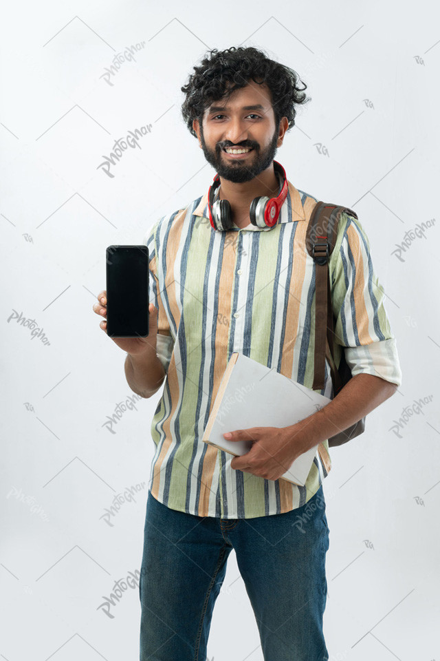 Cheerful male student showing mobile screen