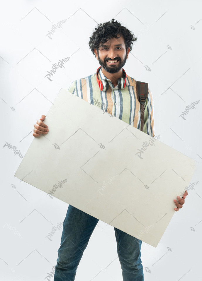 Cheerful man holding empty placard