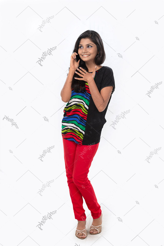 Cheerful young girl talking on phone