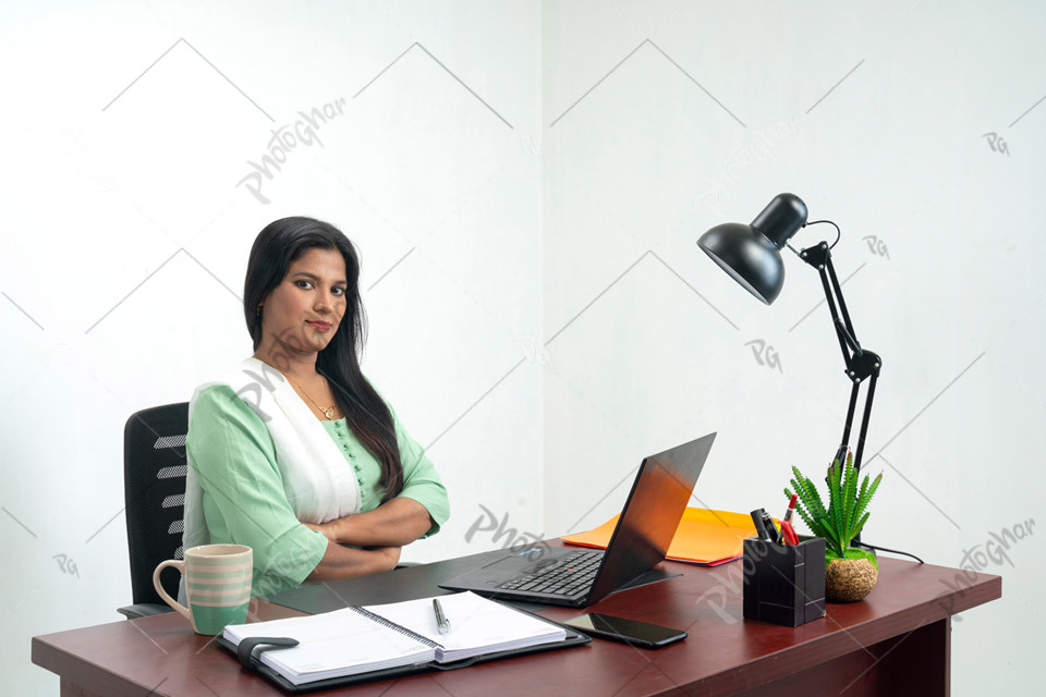 Confidence middle adult woman in office