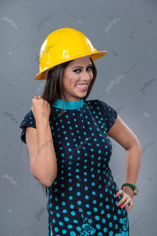 Confident Female Engineer with Helmet