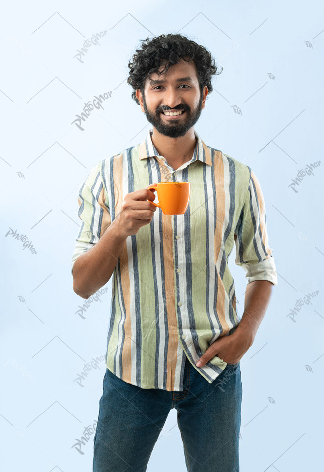 Confident handsome man holding coffee