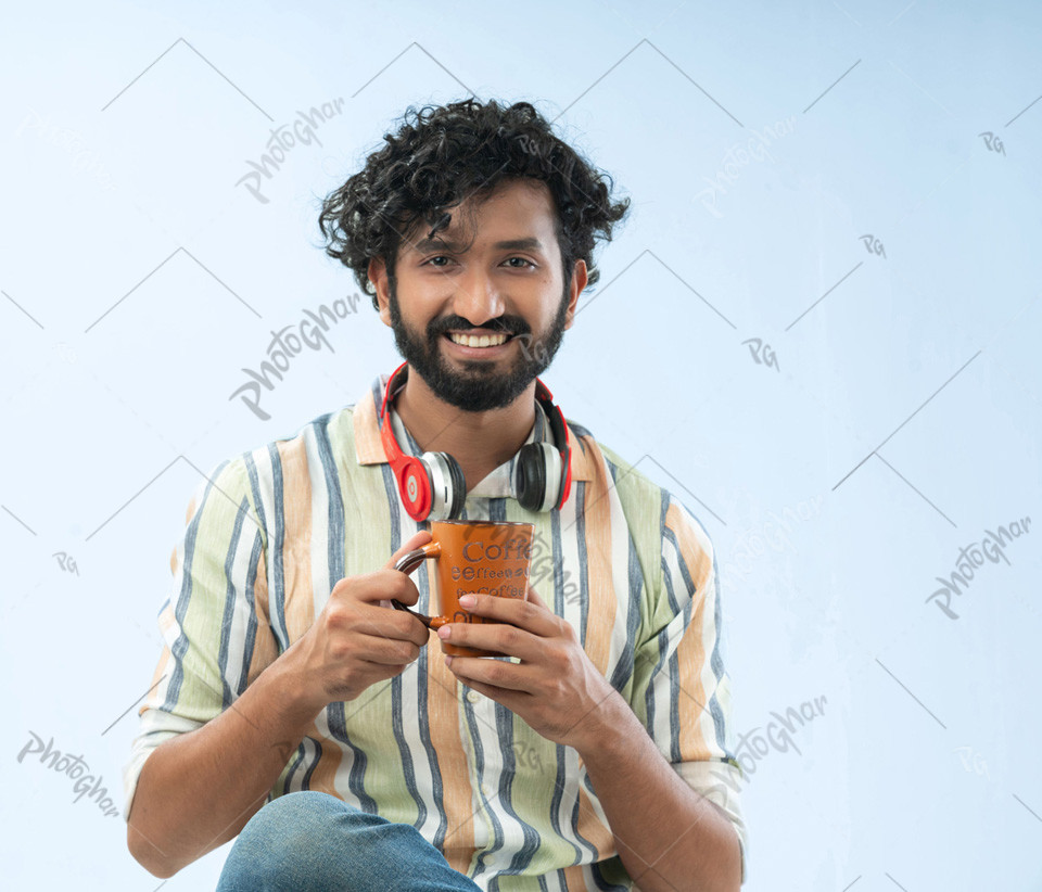 Confident man holding coffee mug