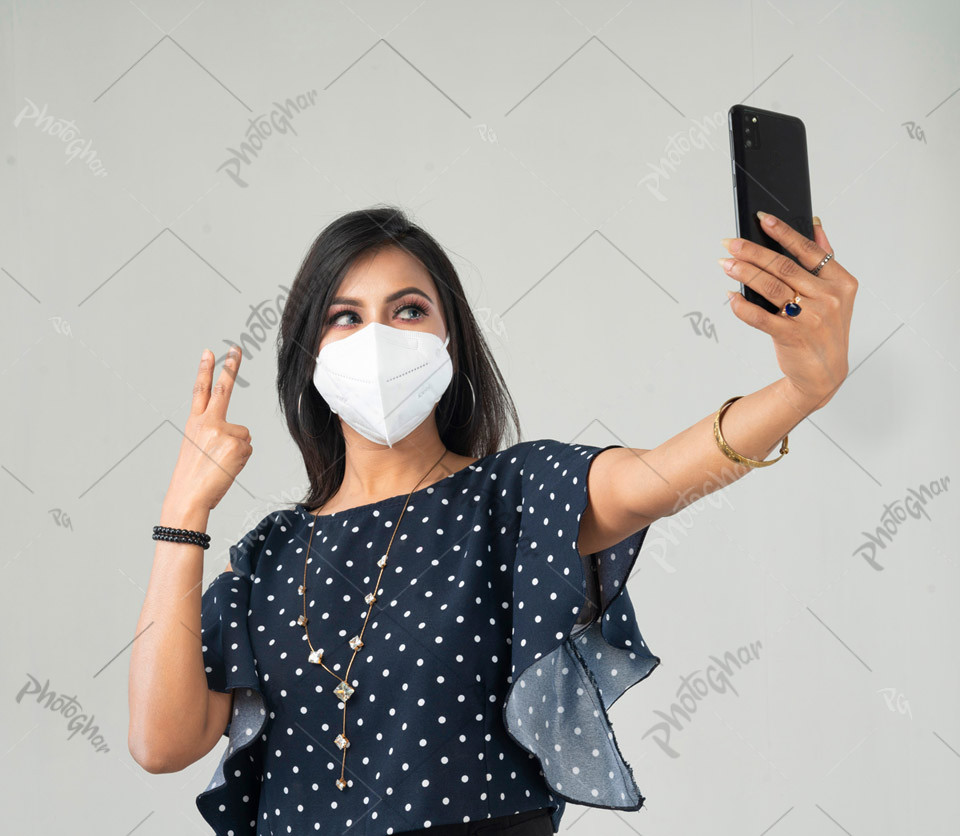 Conscious woman wearing protective mask