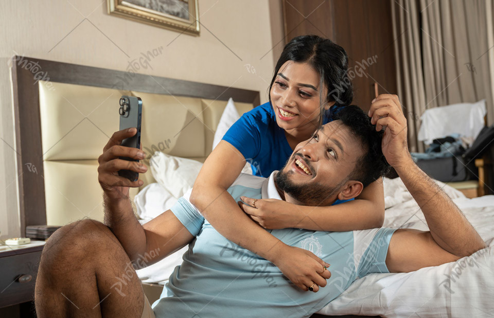 Couple Taking Selfie During Intimate Moment