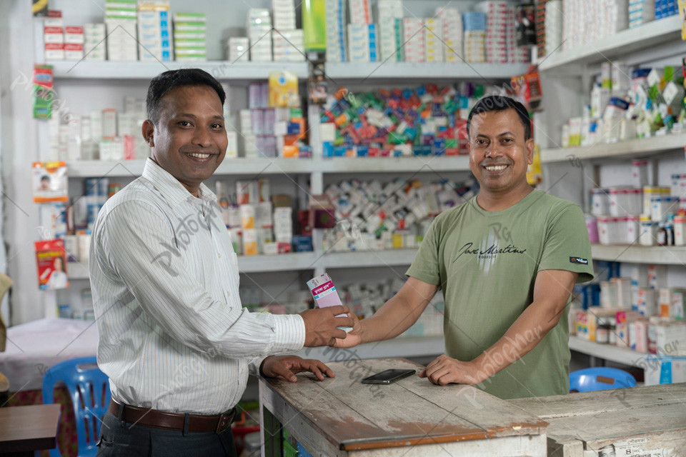 Customer receiving medicine from Salesman