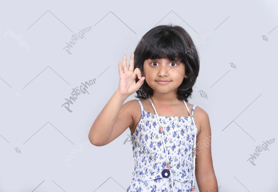 Cute child girl showing tasty sign