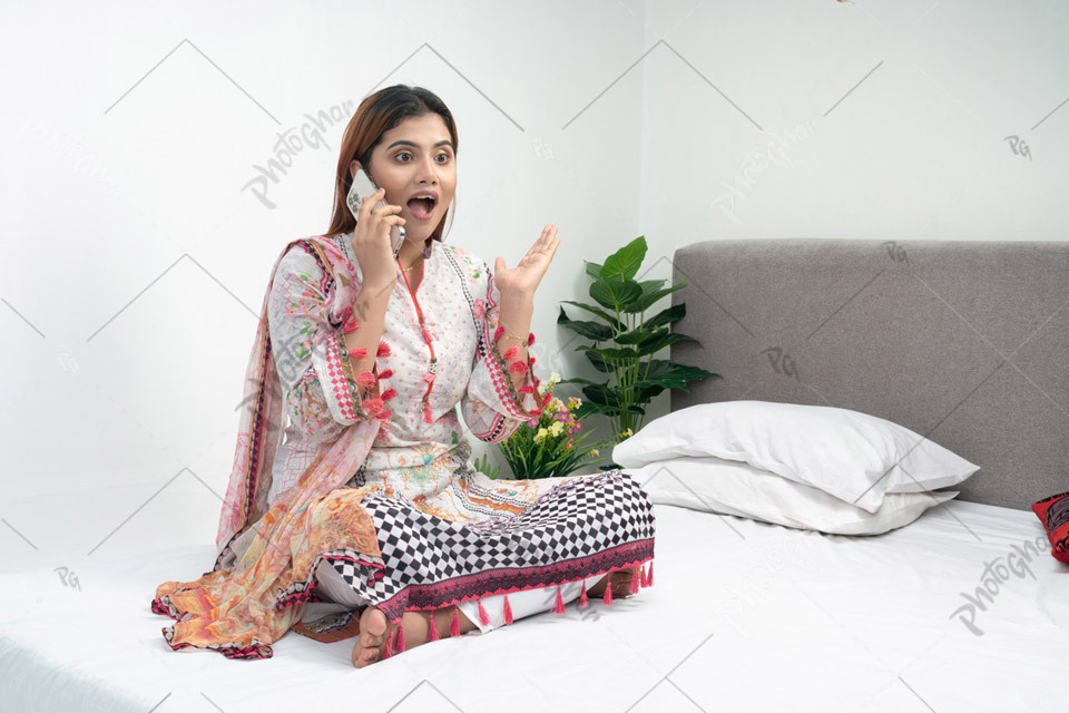 Excited Housewife Receiving Discount Offer on Phone