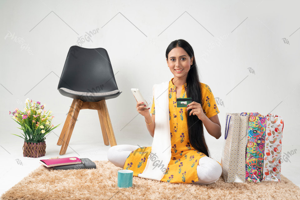 Excited Housewife with Shopping Bags and Credit Card