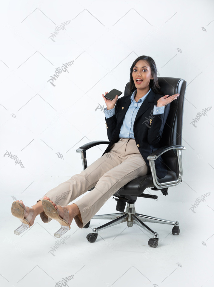 Excited businesswoman jumping from chair