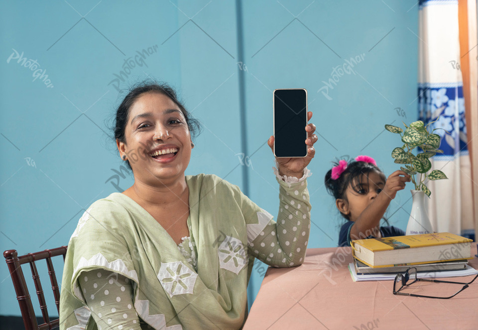 Excited happy female school teacher using a mobile a