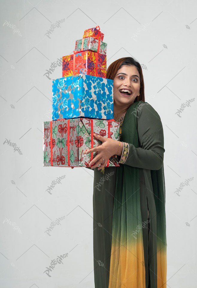 Excited housewife holding gift boxs