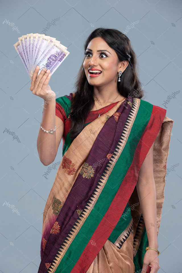 Excited lady holding the new banknotes