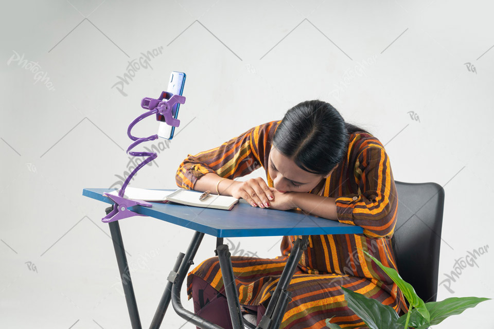 Exhausted Student Asleep While Studying Online