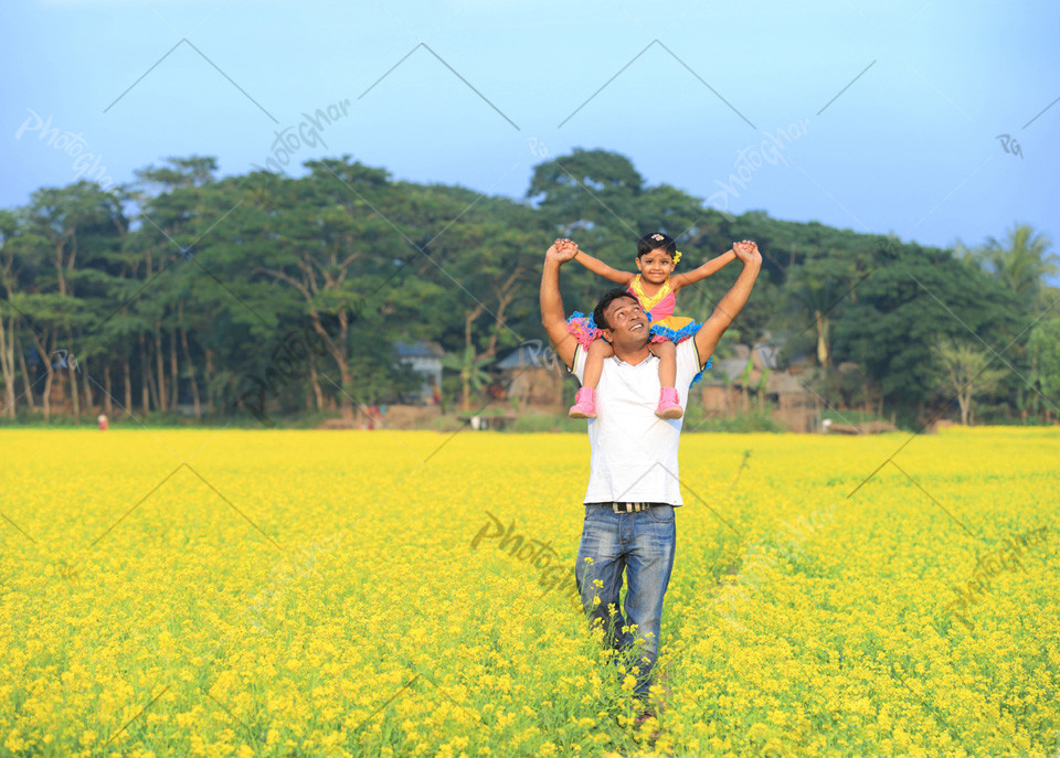 Father carrying child on shoulders