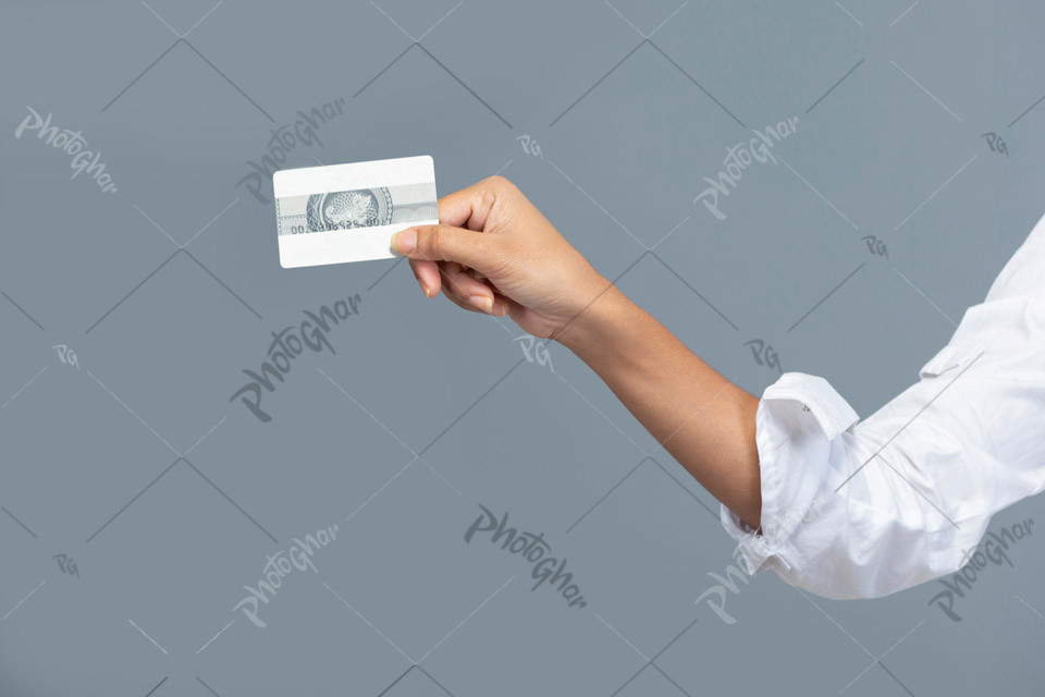 Female hand holding modern bank card